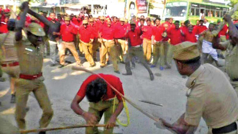 Police attacking red volunteers during the march